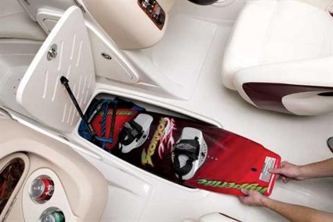 In-floor storage is provided for skis and wakeboards. - Photo 24